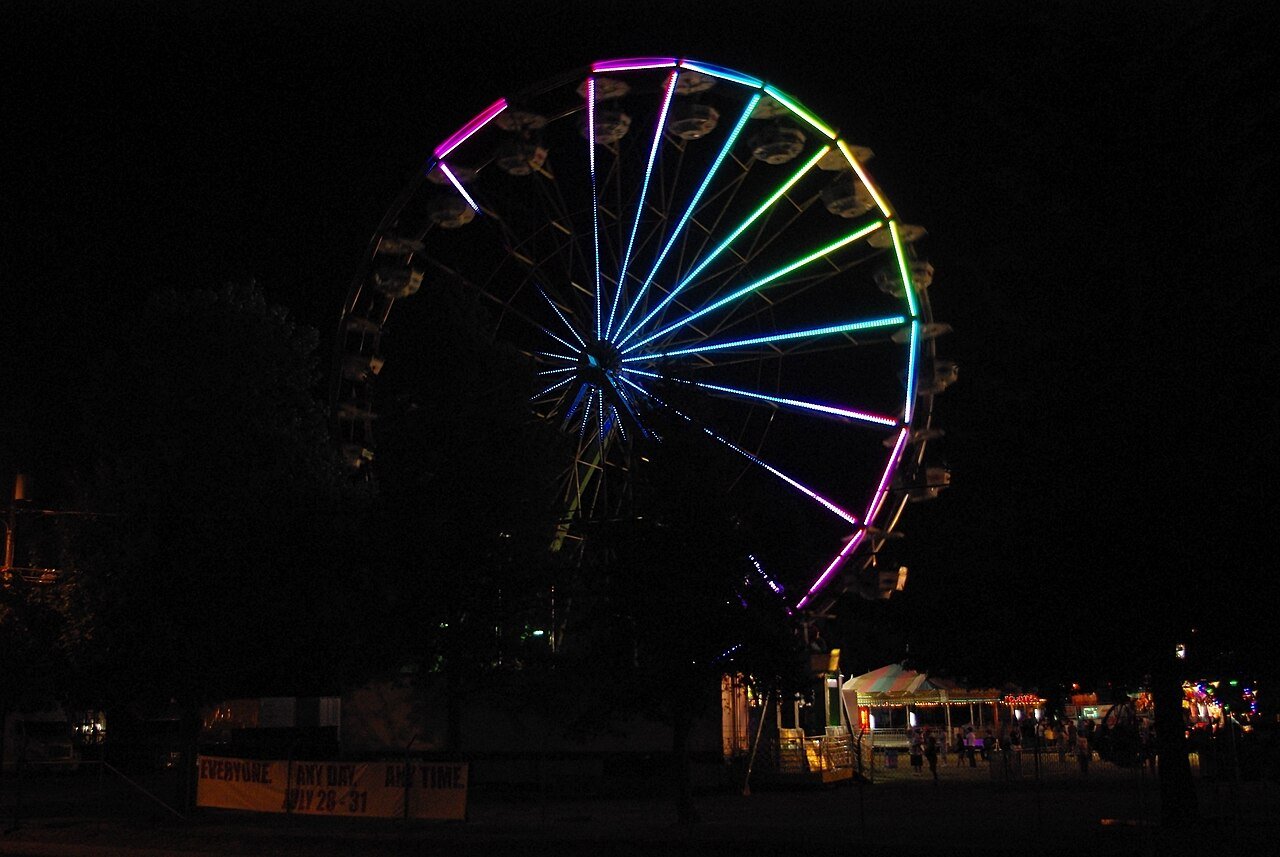 Ferris wheel lit up at the Monterey County Fair at night